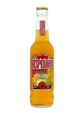 ROME, ITALY - NOVEMBER 15, 2022. Bottle of Desperados beer isolated on white background. Desperados is a tequila-flavoured pale lager beer produced by Heineken in the Karlovačko Brewery.
