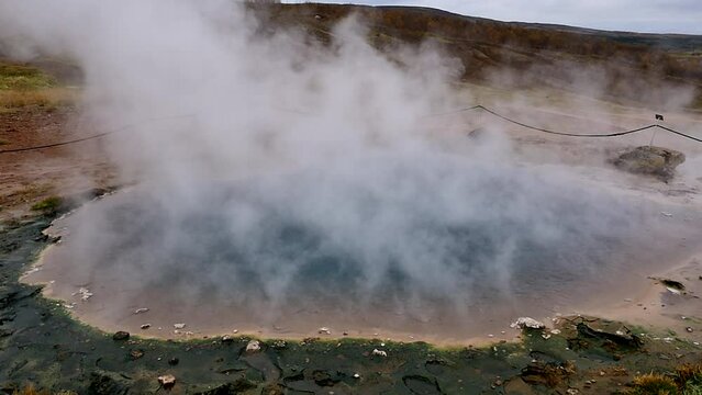 steam comes from geothermal mud pool in iceland. slow motion. Namafjall Hverir geothermal area