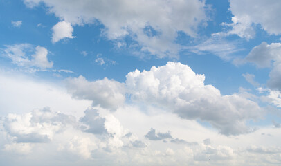 Naklejka na ściany i meble blue sky with fluffy clouds in daylight
