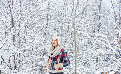 Cheerful emotional girl having fun outdoors. Winter outfit. Woman wear warm accessories stand in snowy nature. Winter fashion collection. Winter admirer. Favorite season. Walk in snowy forest