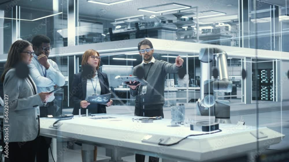Aufkleber Robotics Engineers, Project Manager and Machinery Operator Collaborate on a Robot Arm Project, Standing with Tablet Computers in Scientific Technology Lab. Team Developing an AI Robotic Arm.