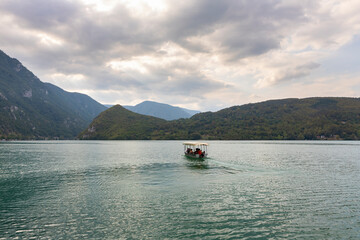 Boat cruise from lake Perucac at Tara mountain in Serbia through the Drina River to Visegrad in Bosnia