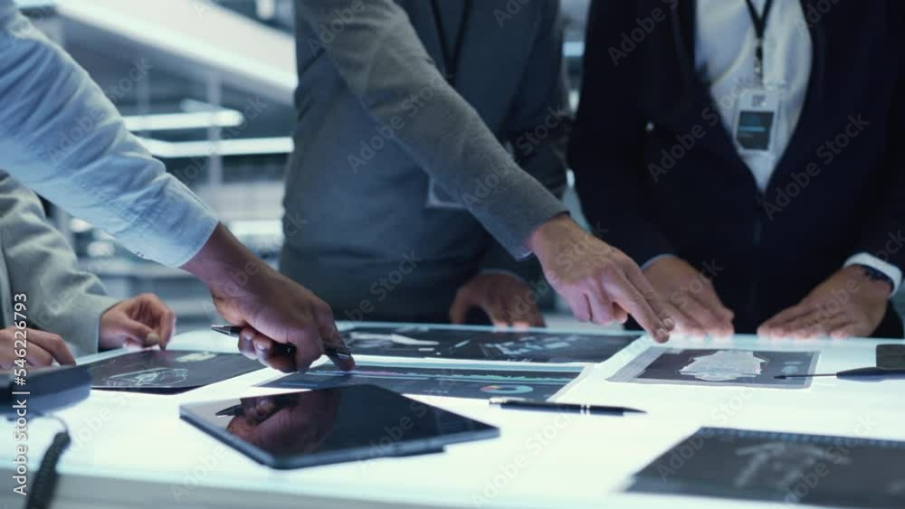Aufkleber executive office meeting of chief engineers discussing important data points of their latest industr