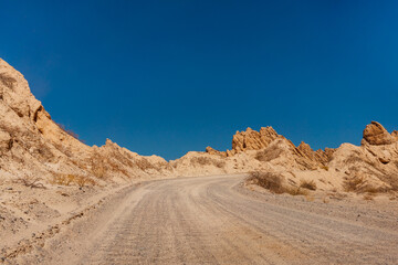 Road through the province of Salta from Salta to Cafayate through the quebrada de las conchas, northern Argentina. The dust road of route 40