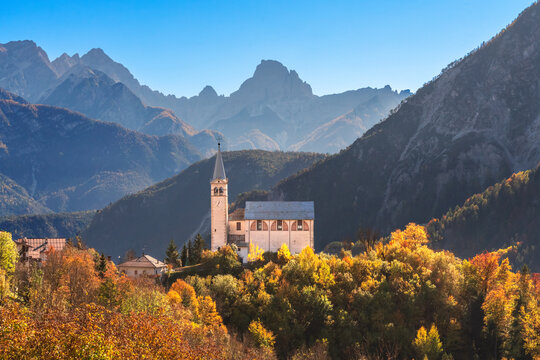 Church in the mountains in autumn, Dolomites, Veneto, Italy
