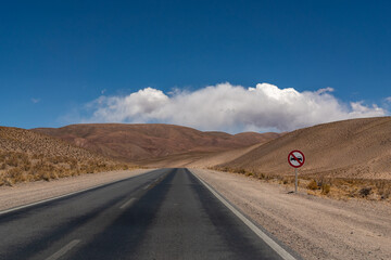 Travel into the unknown. Empty road in the Andes mountain range desert, on the way to Salta, Argentina.