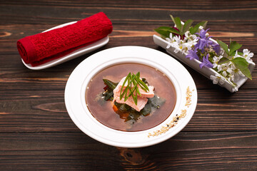 Miso soup with salmon fish on a wooden background