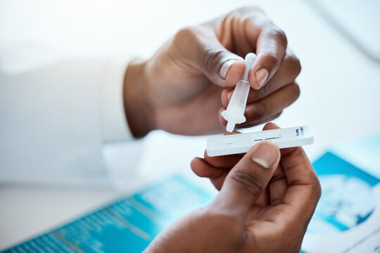 Hands, Covid And Doctor With Antigen Test In Hospital For Healthcare, Wellness And Rapid Viral Testing. Pcr, Covid 19 And Black Male Physician With Medical Kit For Examination, Diagnosis Or Results.