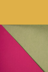 Textured and plain coloured papers forming two triangles and vertical blank rectangle for creative cover designing