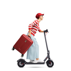 Woman holding a trolley bag and riding an e-scooter