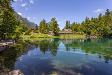 Fototapeta na wymiar View of Blausee (The Blue lake) in Bernese Oberland, famous tourist destination in Switzerland