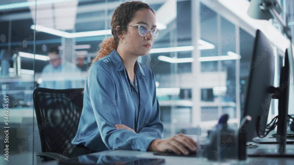 Poster Happy Multiethnic Female Industrial Engineer Developing 3D Model of a Circuit Motherboard on Computer CAD Software in a Startup Facility. Modern Technological Research and Development Center.