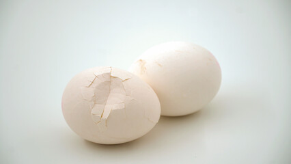 Broken and cracked egg shell on an isolated background