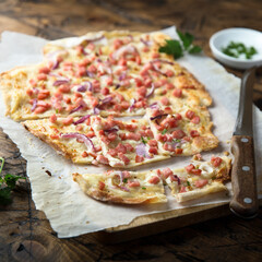 Traditional homemade tarte flambee with ham