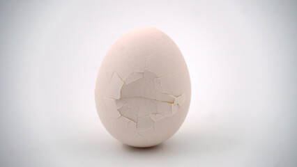 Broken and cracked egg shell on an isolated background