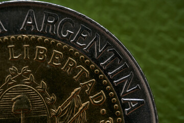 Details of an Argentine coin where it says Argentine Republic and freedom.