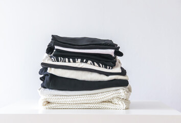 Stack of folded colorful clothes. Compact storage organizing