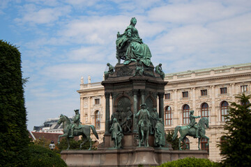 Facade of the Natural History Museum and statues of Empress Maria Theresa (ruler of the Habsburg dominions) monument in the old town of Vienna, Austria, Central Europe. Ancient bronze statue closeup. 