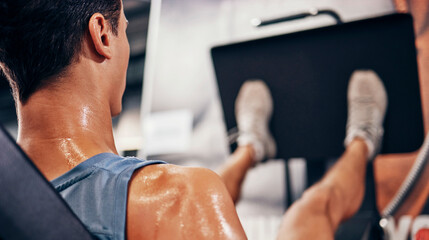 Fitness, man sweating using leg press for workout, health and wellness, strong muscle and cardio in...
