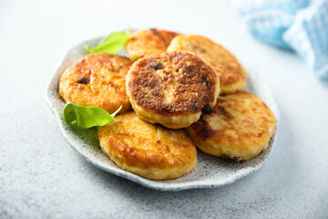 Homemade savory potato pancakes with fresh basil