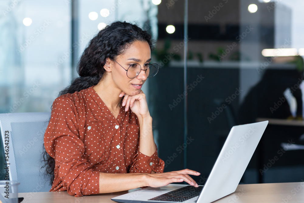 Wall mural successful indian woman developer programmer working inside modern office, using laptop at work to w