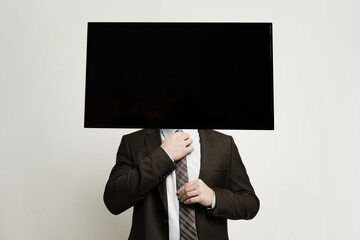 TV headed businessman standing on white background. Brainwash and manipulation concept