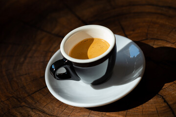 Espresso with thick crema in a black cup - obrazy, fototapety, plakaty