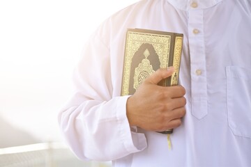 Muslim man reading holy quran. islamic concept