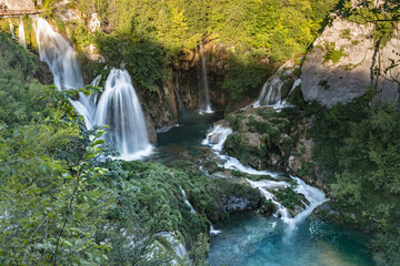 Majestic view of waterfalls with crystal clear water in forest in The Plitvice Lakes National Park in Croatia Europe.