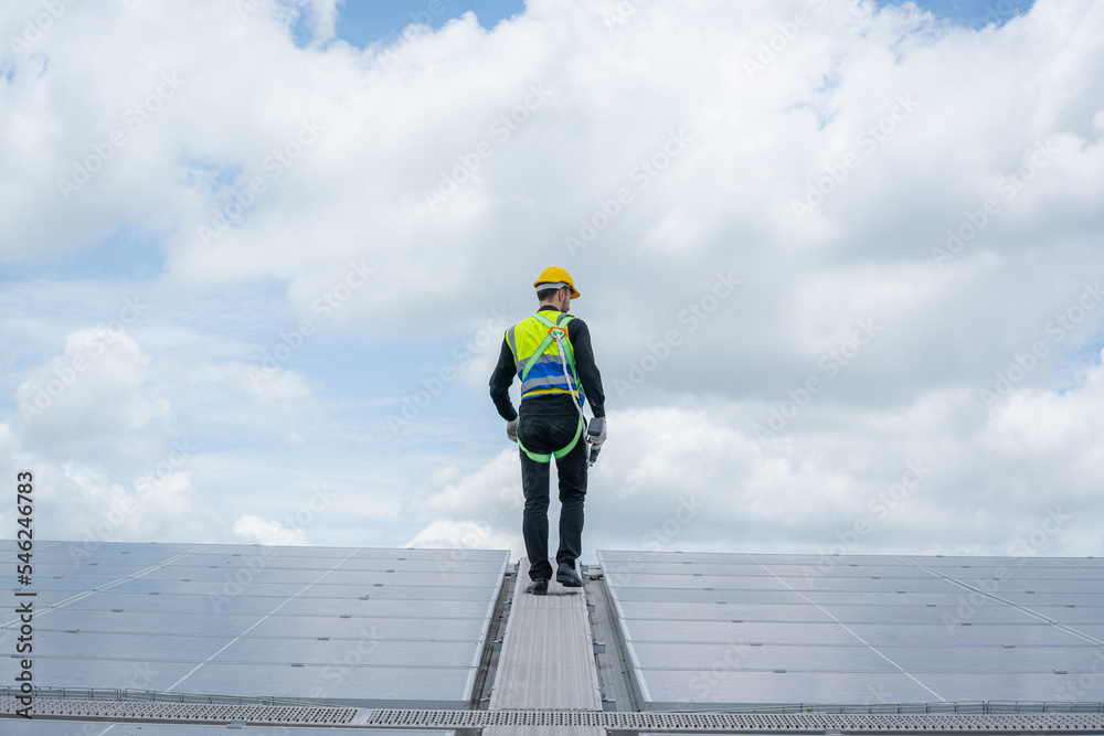 Aufkleber engineers checking the operation of the system solar cell on roof at factory,alternative energy to c