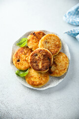 Homemade savory potato pancakes with fresh basil