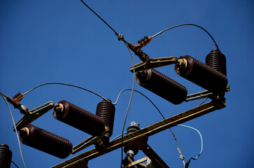 Obraz premium transformer with fuses against lightning strikes. glass tubes will crack in case of overvoltage. The basic parts of power transformers are the magnetic circuit, the winding and the cooling oil system