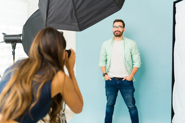 Professional photographer working with a male model