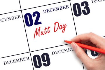 December 2nd. Hand writing text Mutt Day on calendar date. Save the date.