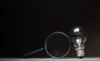 magnifying glass and bulb