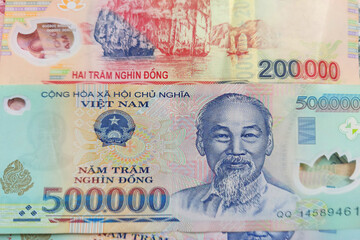 Vietnamese dong banknotes close-up. Money background. Vietnamese currency - dongs. Pattern texture and background of Vietnam dong money, currency banknotes ready for exchange and business investment