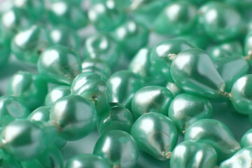 Green plastic beads necklace background