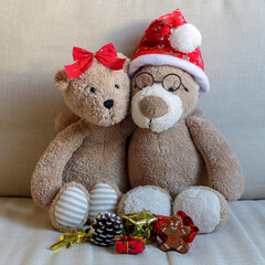 Christmas teddy bear couple portrait on a sofa