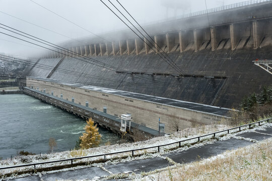 Russia Irkutsk region Bratsk 29.09.2022 The Bratsk Hydroelectric Power Station. A dam on the Angara River and adjacent hydroelectric power station in the fog