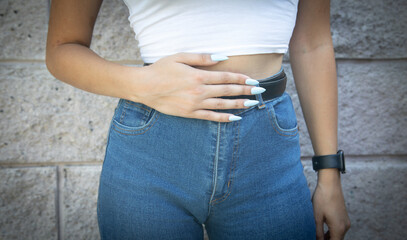 Caucasian woman suffering from belly pain.