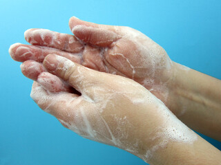 Fototapeta premium Woman cleans and washes her hands. Hygiene concept.