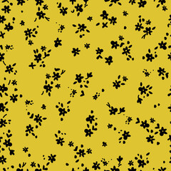 Seamless vintage pattern. Small black flowers and leaves. yellow  background. vector texture. Fashionable print for textiles and wallpaper.