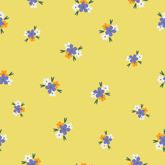 Fototapeta na wymiar Cute floral pattern. Seamless vector texture. An elegant template for fashionable prints. Print with colored flowers, green leaves. yellow background.