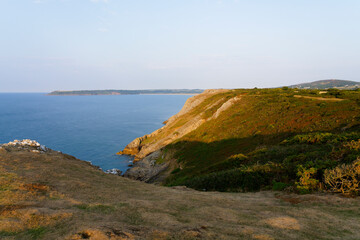 Daybreak on the limestone cliffs near Southgate, Wales.