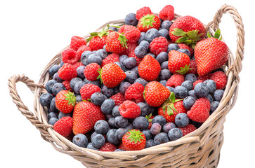 Ripe strawberries and blueberries in a basket on a white background
