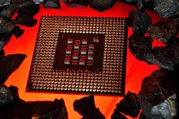 The microprocessor from the computer lies on hot coals. Close-up