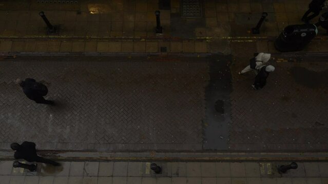 Overhead Shot People Walking London Street Raining Wet