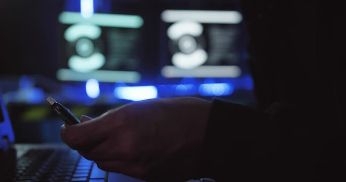A hacker is stealing data from a computer.