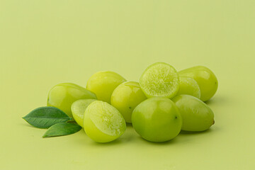 A bunch of Shine Muscat green grape on green background