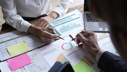 Asian business adviser meeting to analyze and discuss the situation on the financial report in the meeting room.Investment Consultant,Financial Consultant,Financial advisor and accounting concept